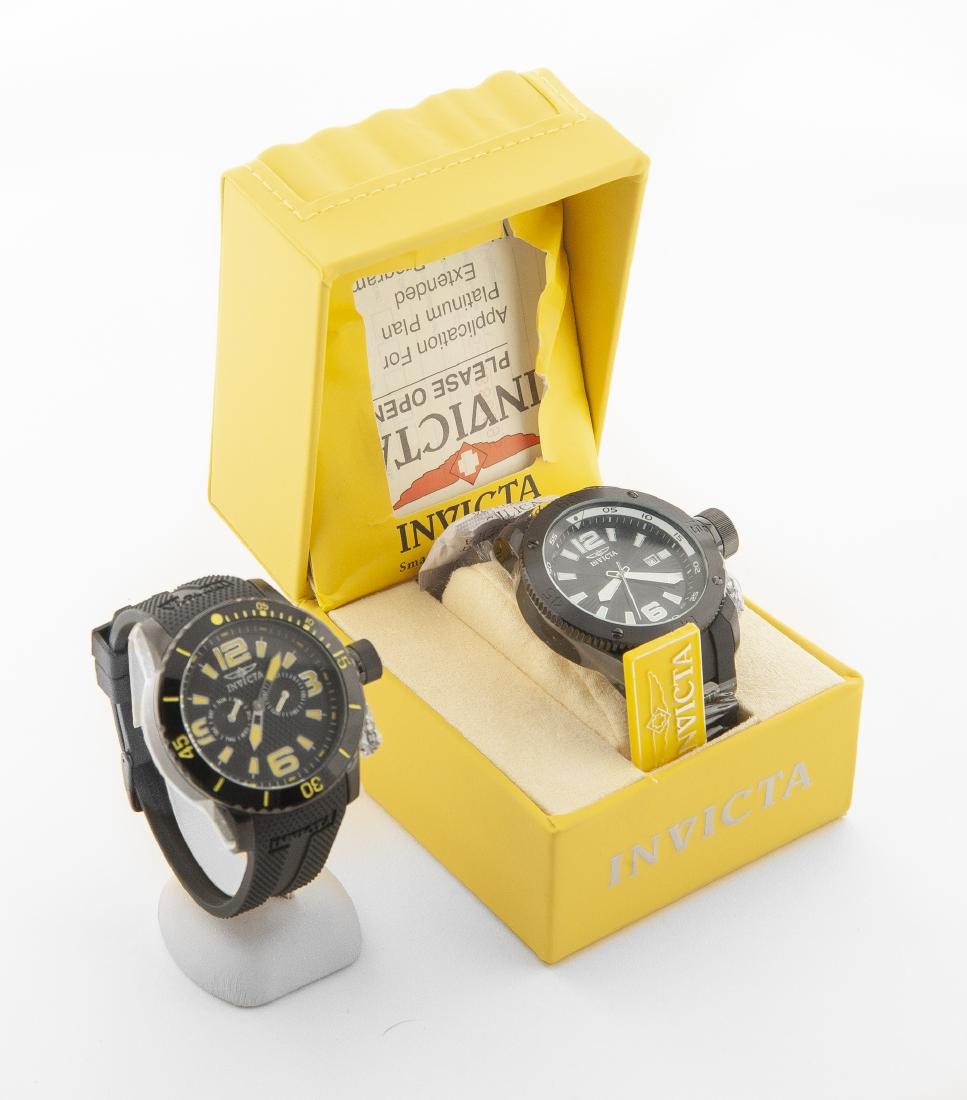 2 Invicta Men's Wristwatches: DESCRIPTION: Two Invicta men's wristwatches. Includes: 1) Invicta Force To Be Reckoned With model no.12966 in OB with paperwork. 2-1/4" lug to lug. 2) Invicta Specialty Collection Making History model