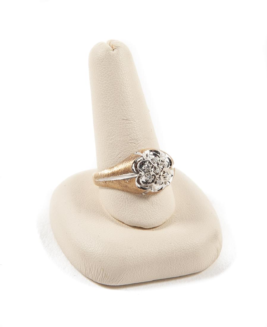 10K .21 CTW Diamond Flower Ring: DESCRIPTION: 10k .21 CTW diamond flower ring. Marked "10k S&S". MEASUREMENTS: 2.6 dwt (4.1 gr). Size 10.5. CONDITION: Light wear.