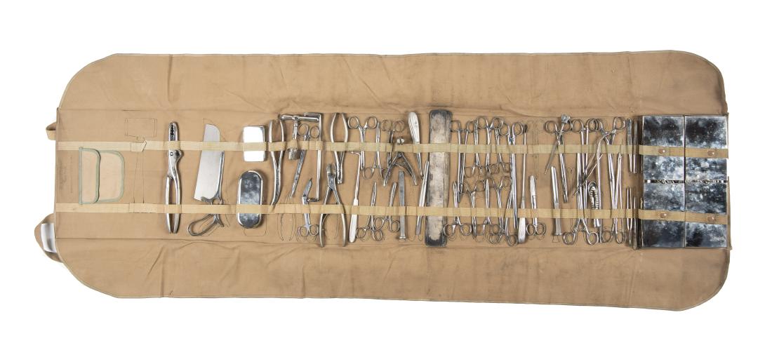 WWI General Surgery Field Kit in Canvas Roll: DESCRIPTION: U.S. WWI field surgical kit with numerous surgical tools in a canvas roll. Steel cases marked "Pat'd 1912". PROVENANCE: Per consignor information belonged to Dr. Charles Snodwn Pancoast o