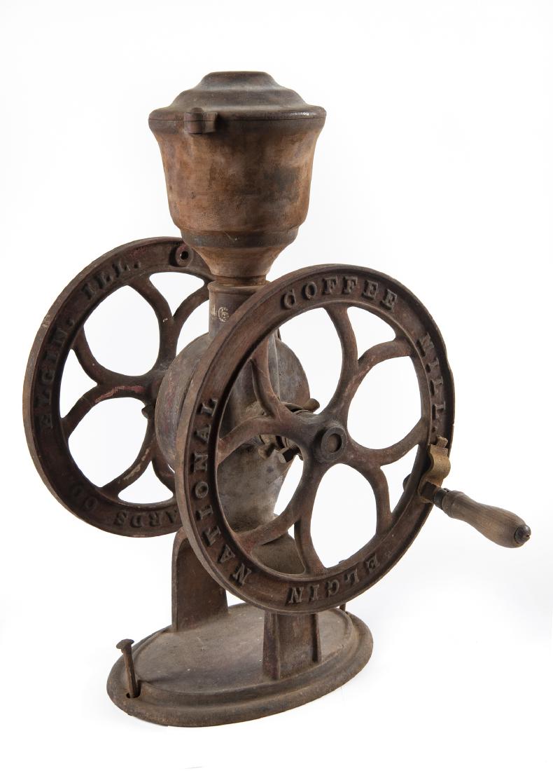 Elgin National Countertop Coffee Grinder: DESCRIPTION: Elgin National cast iron countertop coffee grinder. Marked for Woodruff & Edwards Co. Elgin, Ill. Original red paint. MEASUREMENTS: 22-1/4" high CONDITION: Overall corrosion and losses to