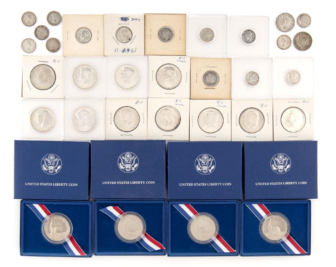 32 US Coins: DESCRIPTION: Thirty-two US coins incl (11) 40 % Kennedy half dollars, (4) 1986 Statue of Liberty proof half dollars, $1.20 face Canadian silver, (8) silver dimes 1904-1964.