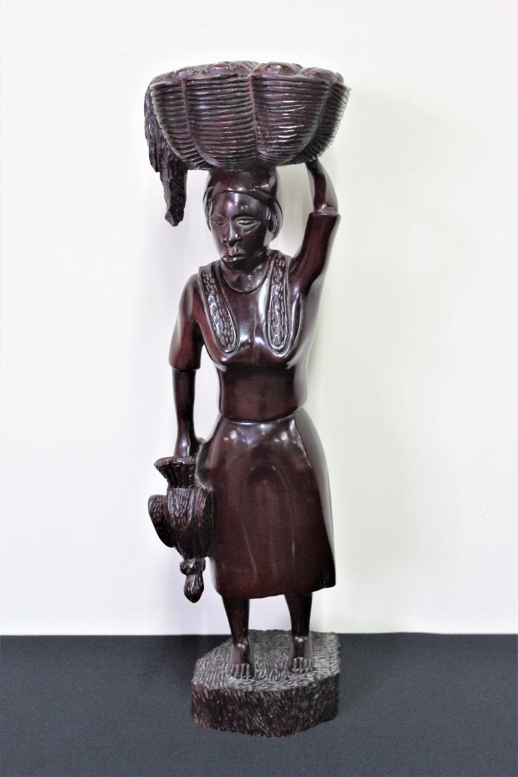 Haiti Carved Mahogany Figure: Hand carved Caribbean Craft genuine mahogany made in Haiti statue. MEAUSREMENTS: 9" wide x 7" deep x 30" high.