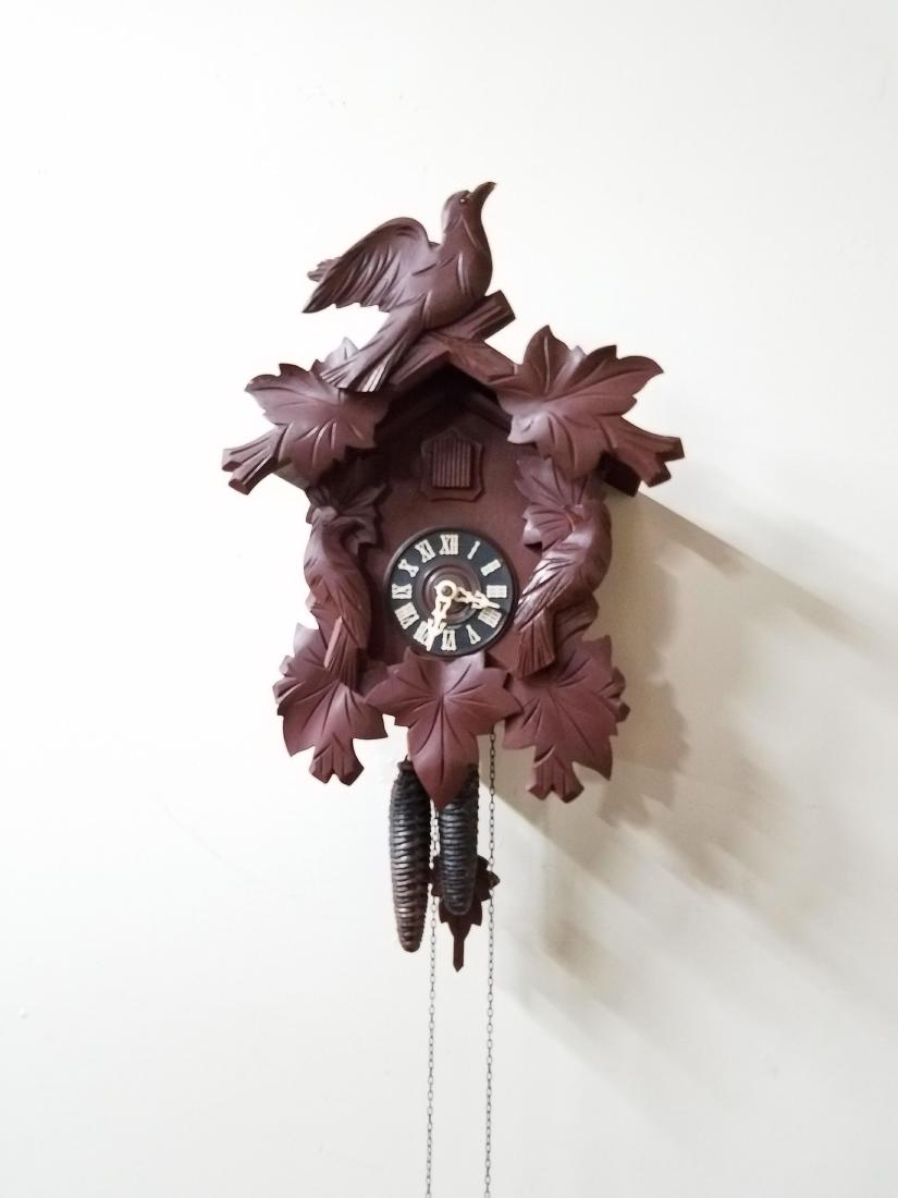 German Cuckoo Clock: 15-1/4" high x 11-1/4" wide.