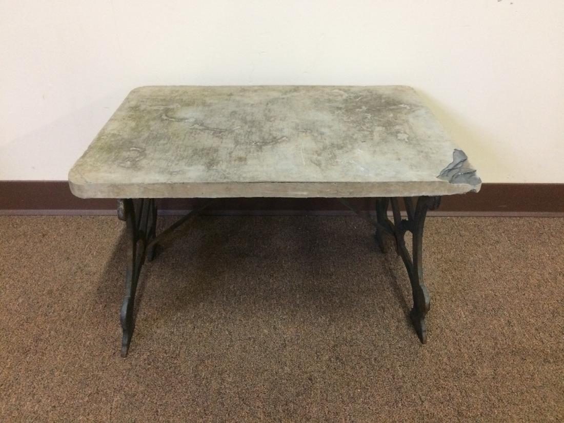 Table with Slate Top and Iron Base: Repair and losses to one corner. 24-1/2" wide x 18" deep x 14-1/2" high