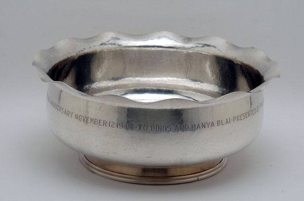 Mueller-Monk Hand Hammered Silver Bowl: DESCRIPTION: Footed bowl with furrled rim and hand hammered marks overall. Engraved to side "To Boris and Manya Blai - Presented by the students and faculty of Tyler in honor of the tenth year of the