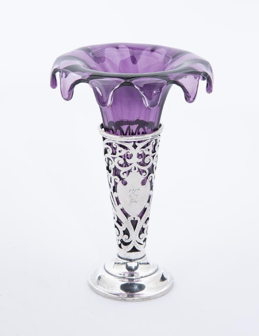 Tiffany Sterling and Purple Glass Bud Vase: DESCRIPTION: Tiffany and Co sterling reticulated bud vase. Monogrammed "B" and marked "Made for Tiffany & Co. Sterling 2271". Includes purple glass insert with flared rim. MEASUREMENTS: Sterling 5" hi