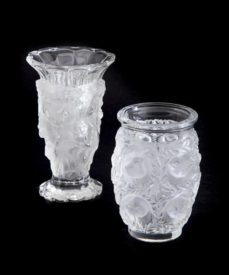 2 Crystal Vases: DESCRIPTION: Two clear and frosted crystal vases. Includes 1) Lalique France vase in the Bagatelle Bird pattern. Etched on bottom "Lalique France". 6-3/4". 2) Czech frosted vase with nude nymphs. Acid