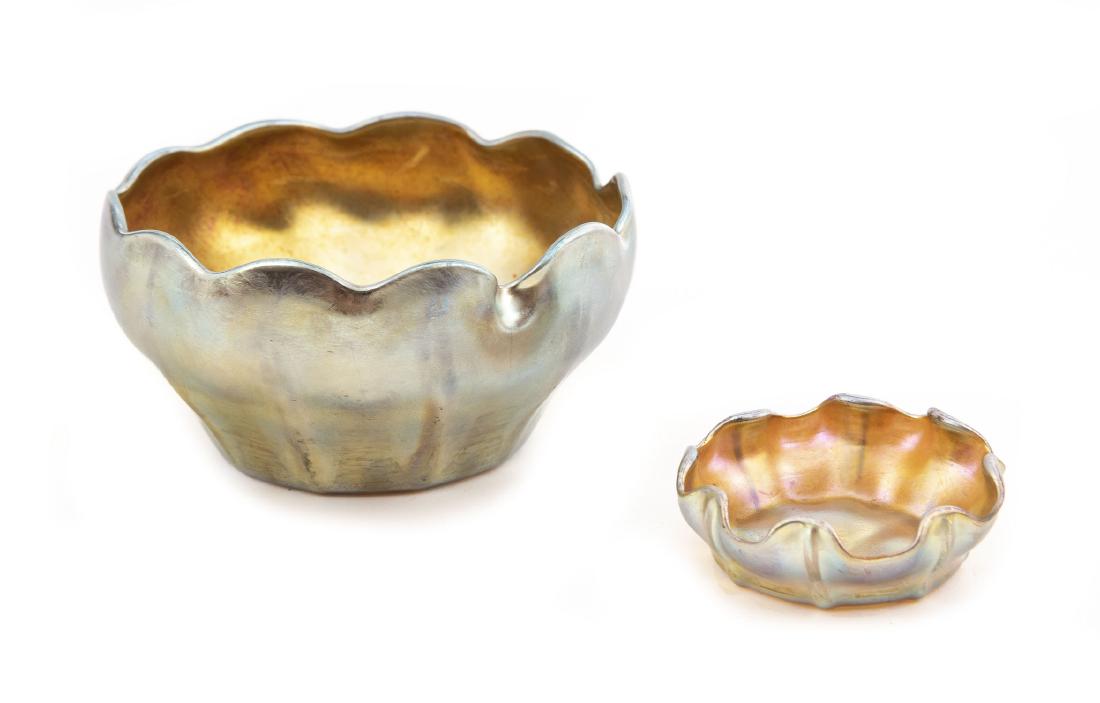 2 Louis C. Tiffany Gold Favrile Glass Bowls: DESCRIPTION: Two Louis Comfort Tiffany iridescent gold favrile glass bowls. Both signed on bottom "L.C.T.". MEASUREMENTS: Salt bowl 2-3/4" x 1". Finger owl 4-3/4" x 2-1/2". CONDITION: Light wear to bo