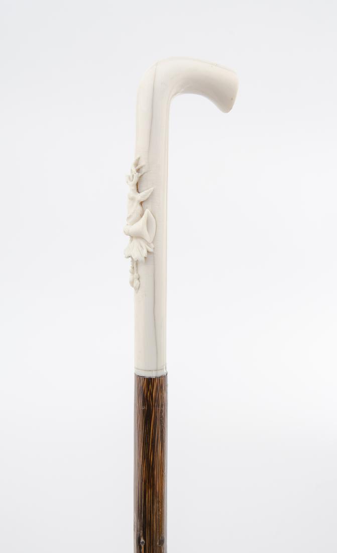 Carved Bone & Wood Cane: DESCRIPTION: Carved bone and wood walking stick or cane. 19th century. Bone handle with applied carved bone stag head, smooth wood shaft, and brass ferrule. Monogrammed "S.B. Eshelman". MEASUREMENTS: