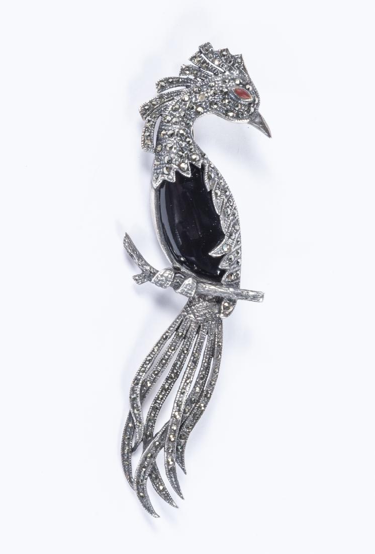 Marcasite Bird of Paradise Sterling Pin: DESCRIPTION: Marcasite Bird of Paradise sterling pin. Marked "925 TH". MEASUREMENTS: 4-1/2" x 1-1/4". CONDITION: Light wear.