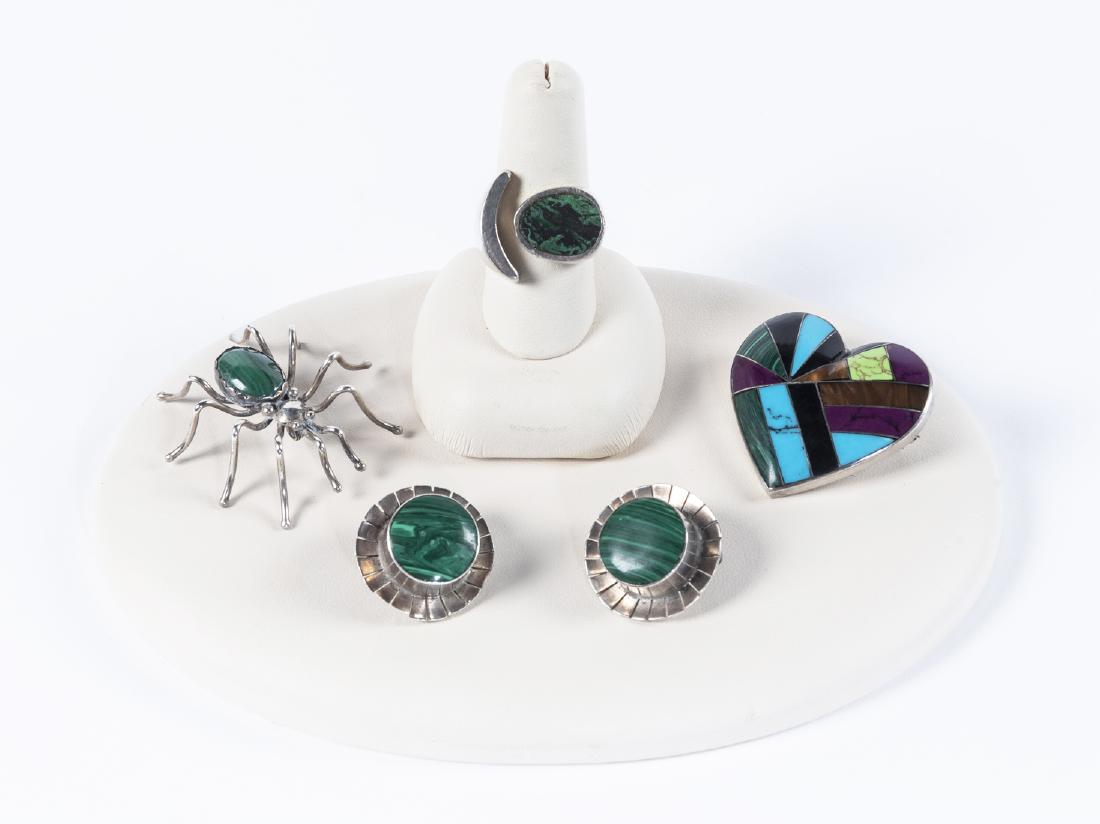 5 Pcs Malachite Mexican Sterling Jewelry: DESCRIPTION: Five pieces Mexican sterling and malachite jewelry. Includes pair of clip-on earrings, heart pin, man's ring, and spider pin. All but one marked "925". MEASUREMENTS: Various. Ring size 9.