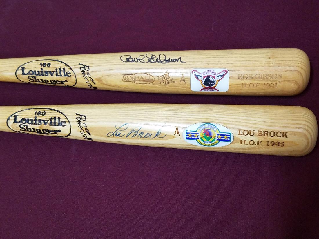 Lou Brock and Bob Gibson Autographed Bats (1 of 3)