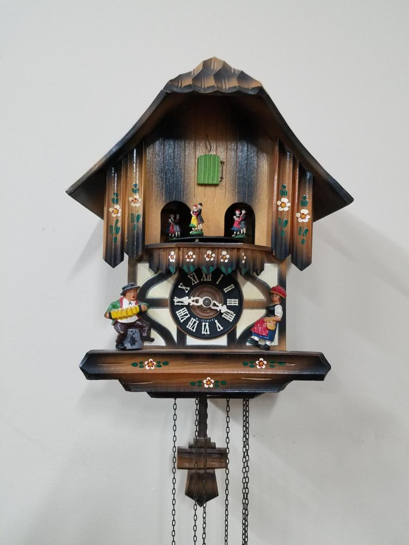 West Germany Cockoo Clock: 9-1/4" wide x 7" deep x 11" high. Working order.