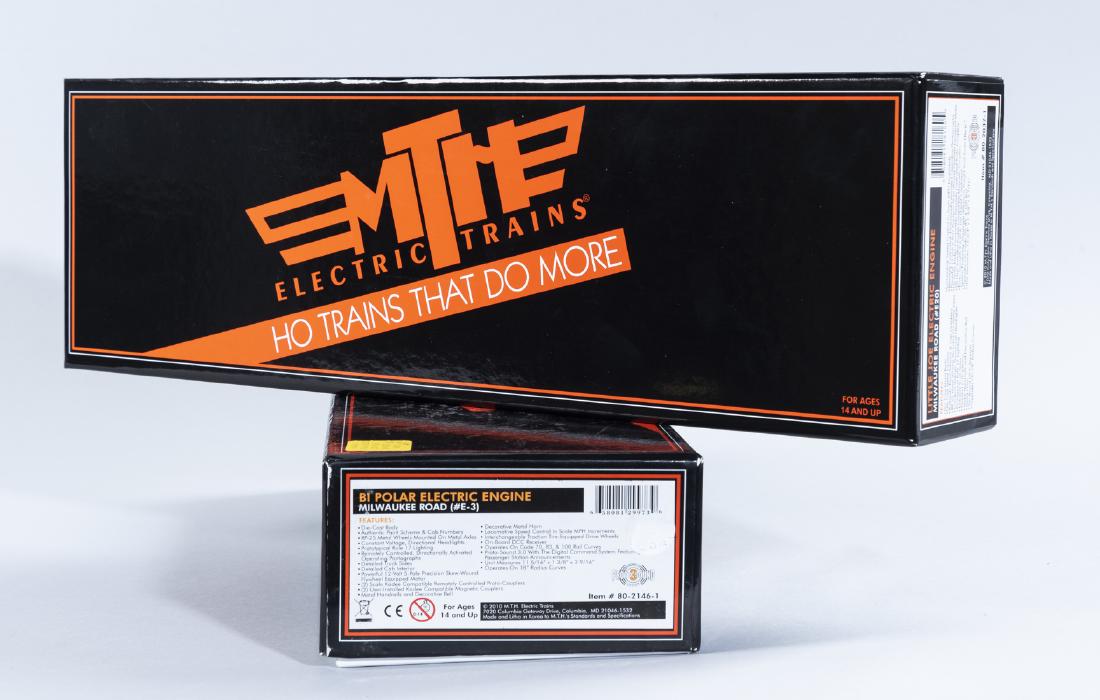 2 MTH HO Electric Engines in OBs: DESCRIPTION: Two MTH HO scale electric trains in original boxes. Includes 80-2037-1 Little Joe electric engine Milwaukee Road (#E20) and 80-2146-1 Bi Polar electric engine Milwaukee Road (#E-3). CONDI