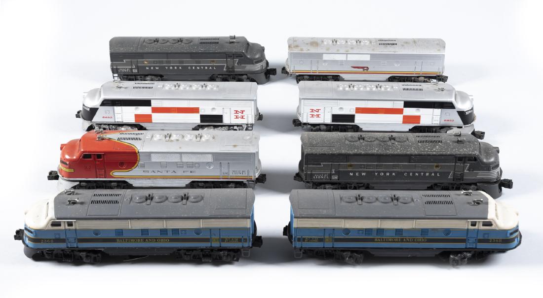 8 Pcs Lionel O/O27 Rolling Stock incl Locos: DESCRIPTION: Eight pieces Lionel O/O27 rolling stock. Includes Santa Fe loco 2383 and unit, New Haven F3 AA dual motor diesel engine and dummy unit 8852, B&O Engine and dummy unit 2368, New York Centr