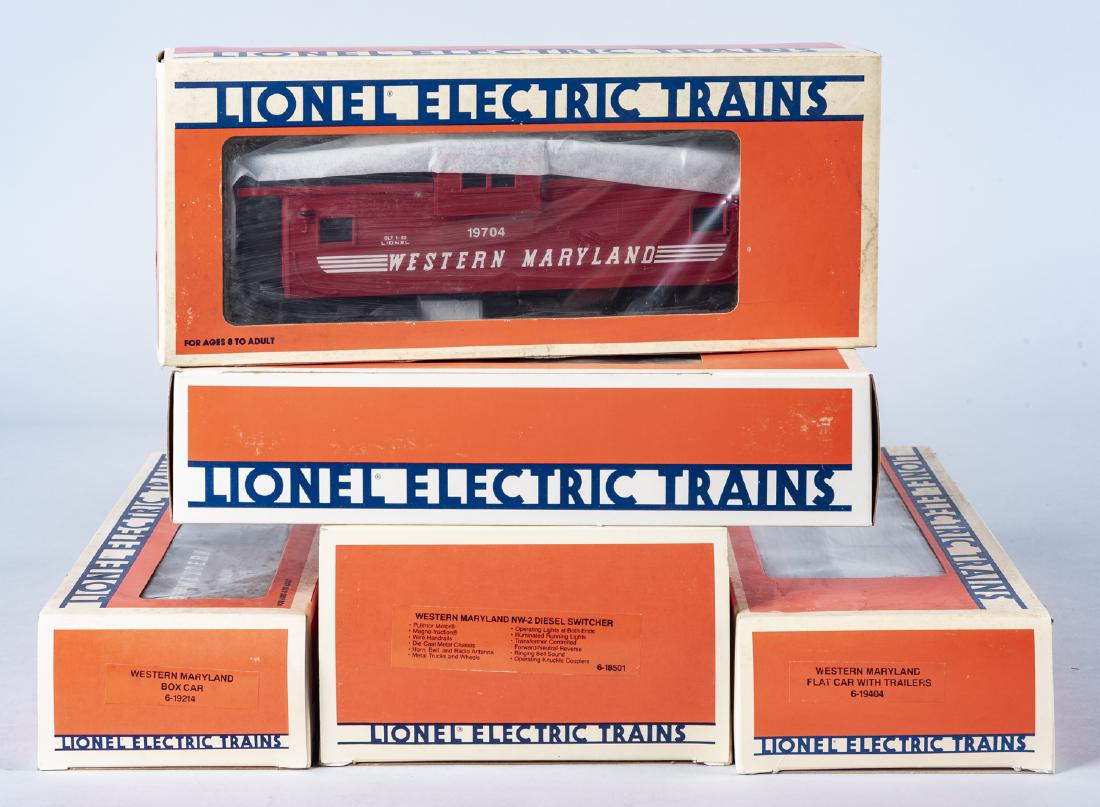 Lionel O/O27 Western Maryland Freight Set: MEASUREMENTS: Lionel O/O27 Western Maryland freight set. Includes NW-2 diesel switcher 18501, and 19214, 19403, 19404, 19704. CONDITION: Each appears unused in original box. Boxes with shelf wear.
