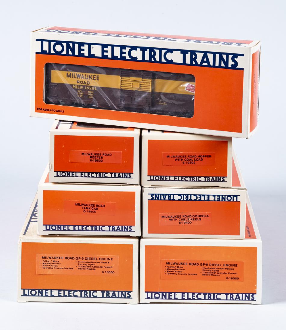 7 Lionel Milwaukee Road O Gauge Inc Engines in OBs: DESCRIPTION: Seven Lionel Milwaukee Road O gauge rolling stock in original boxes. Includes two 6-18500 GP-9 diesel engines, 19204, 19600, 19400, 19302, and 19500. CONDITION: Appears unused in original