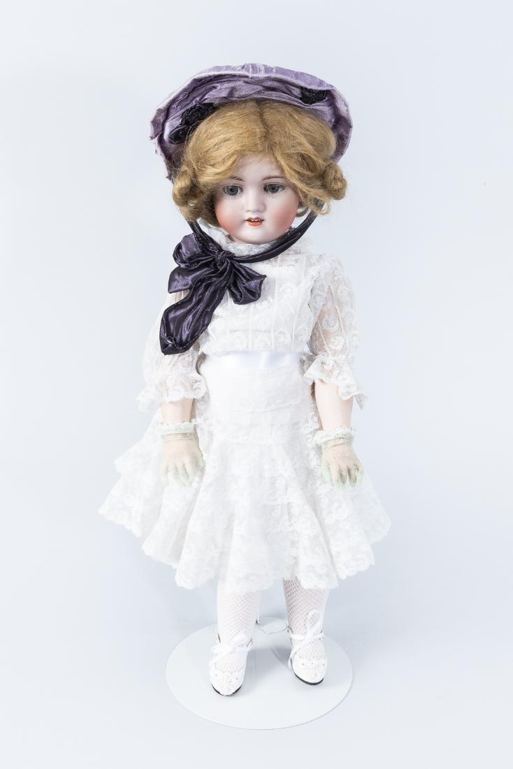 Walkure Bisque Head Doll: DESCRIPTION: Walkure bisque head doll with jointed composition body. Blonde mohair hair, open mouth and upper teeth. With hat, white dress, and gloves. Marked "Walkure Germany 1/46". MEASUREMENTS: 18"