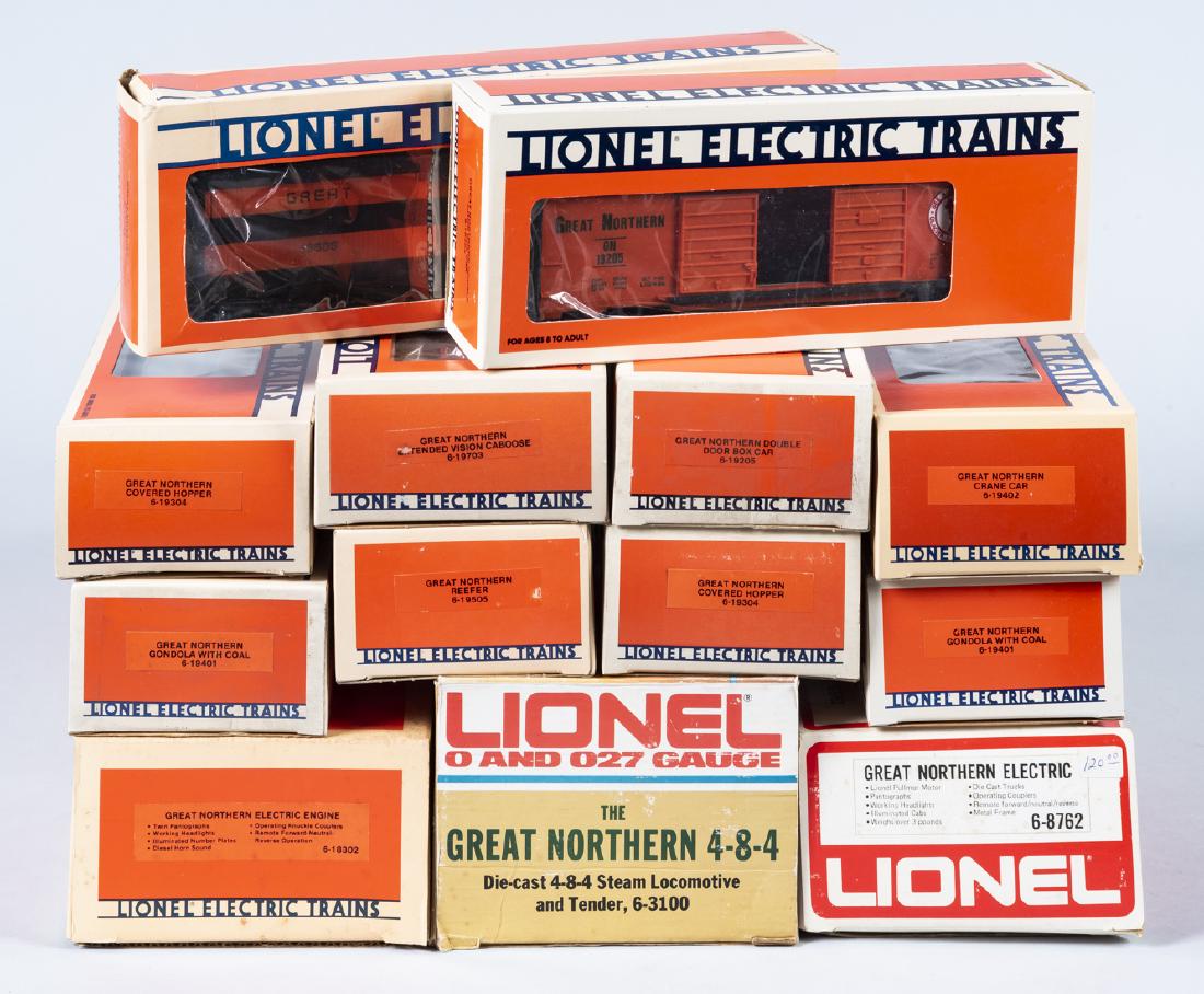 13 Lionel Great Northern Rolling Stock in OBs: DESCRIPTION: Thirteen Lionel Great Northern O gauge rolling stock in original boxes. Includes 6-18302 electric engine, 6-3100 die-cast 4-8-4 steam locomotive and tender, 6-8762 electric engine, two 19