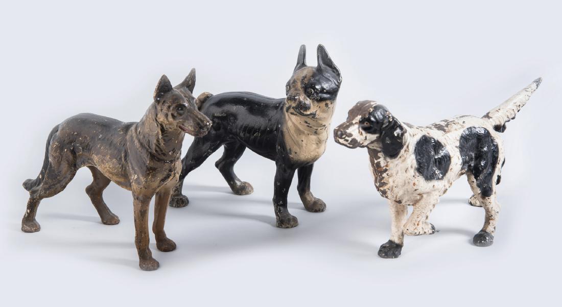 3 Cast Iron Dog Doorstops: DESCRIPTION: Three cast iron dog doorstops. Includes German Shepherd, Hubley Boston Terrier, and French Spaniel. MEASUREMENTS: Each approximately 15" x 10". CONDITION: Paint appears original. Wear to 