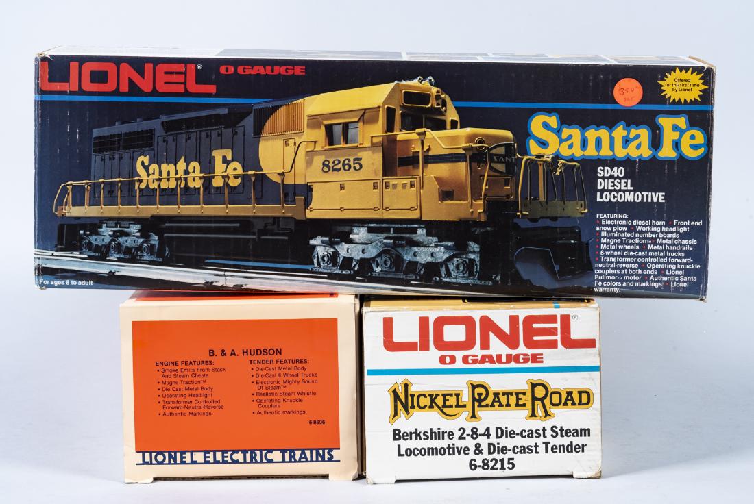 3 Lionel O/O27 Engines in OBs: DESCRIPTION: Three Lionel O/O27 engines in original boxes. Includes Santa Fe SD40 diesel loco 8265, Nickel Plate Road Berkshire 2-8-4 steam loco and tender 8215, B & A Hudson engine and tender 8606. C