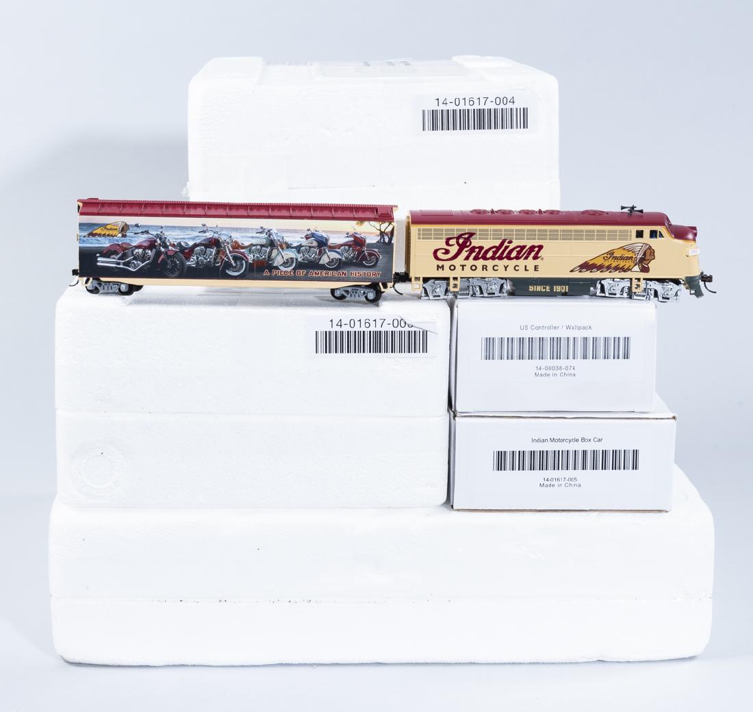 7 Pc Indian Motorcycle Express HO Scale Train Set: DESCRIPTION: Seven piece HO Indian Motorcycle Express train set. Includes two "A Piece of American History Boxcar" (one with COA), "Indian Motorcycle Express 1928 101 Scout" with COA, "Indian Motorcyc