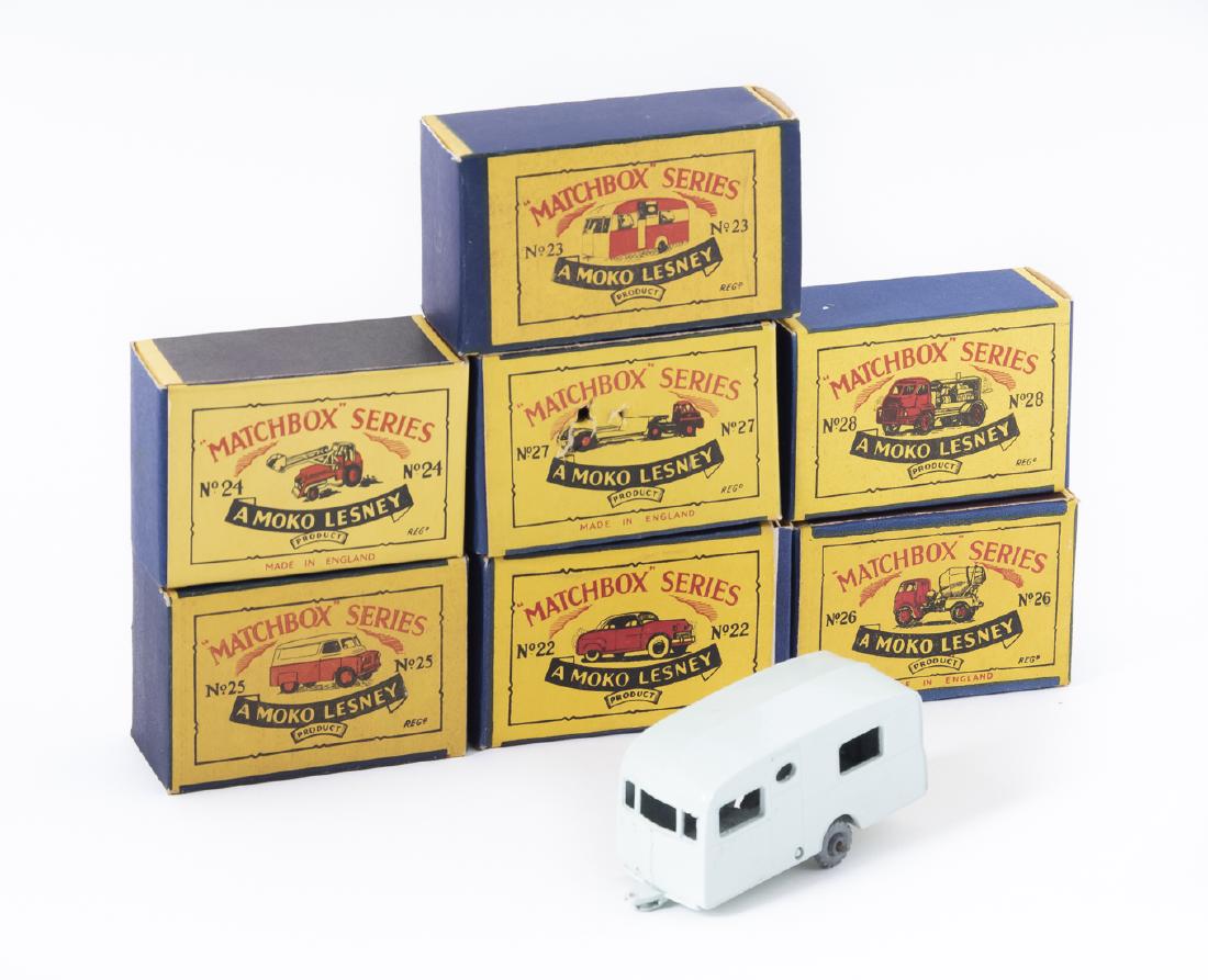 7 Matchbox Series Moko Lesney Vehicles In OBs: DESCRIPTION: Seven Matchbox Series Moko Lesney vehicles in original boxes. Includes issue numbers 22-28. MEASURMENTS: Various. Each box approx. 2-1/4" x 1-1/2". CONDITION: Lightly used in original box