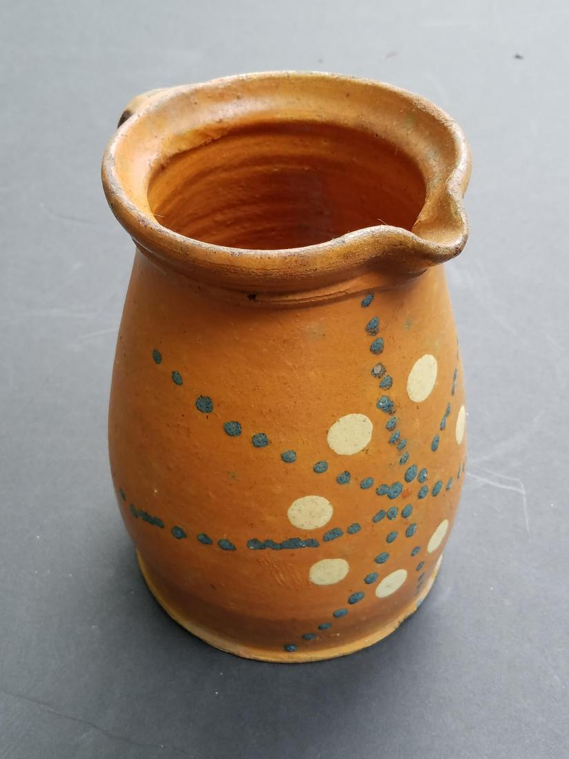 Redware Pitcher: 6" wide X 7 3/4" high.