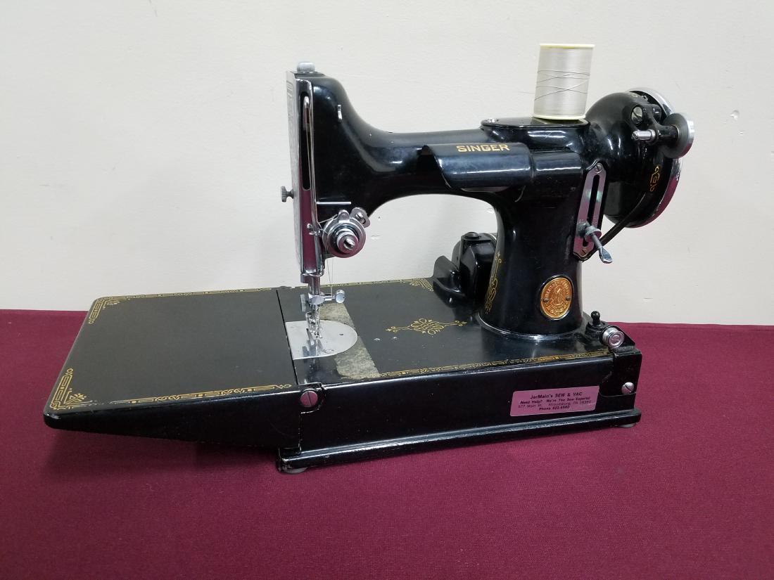 Singer Featherweight Sewing Machine with Case: Case and accessories included. In working order.