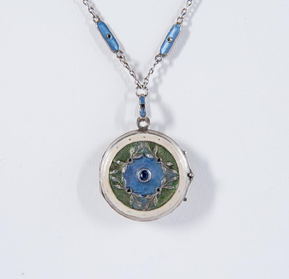 800 Silver Enamel Locket & Chain: Locket 13/16" diameter with center blue stone. Necklace 16-1/2" long.