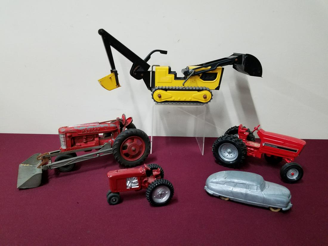 5 Vintage Toy Trucks, Tractors and Car: Includes the 1949 Nash Light car, Hubley, Tonka, and International. Up to 6" high.