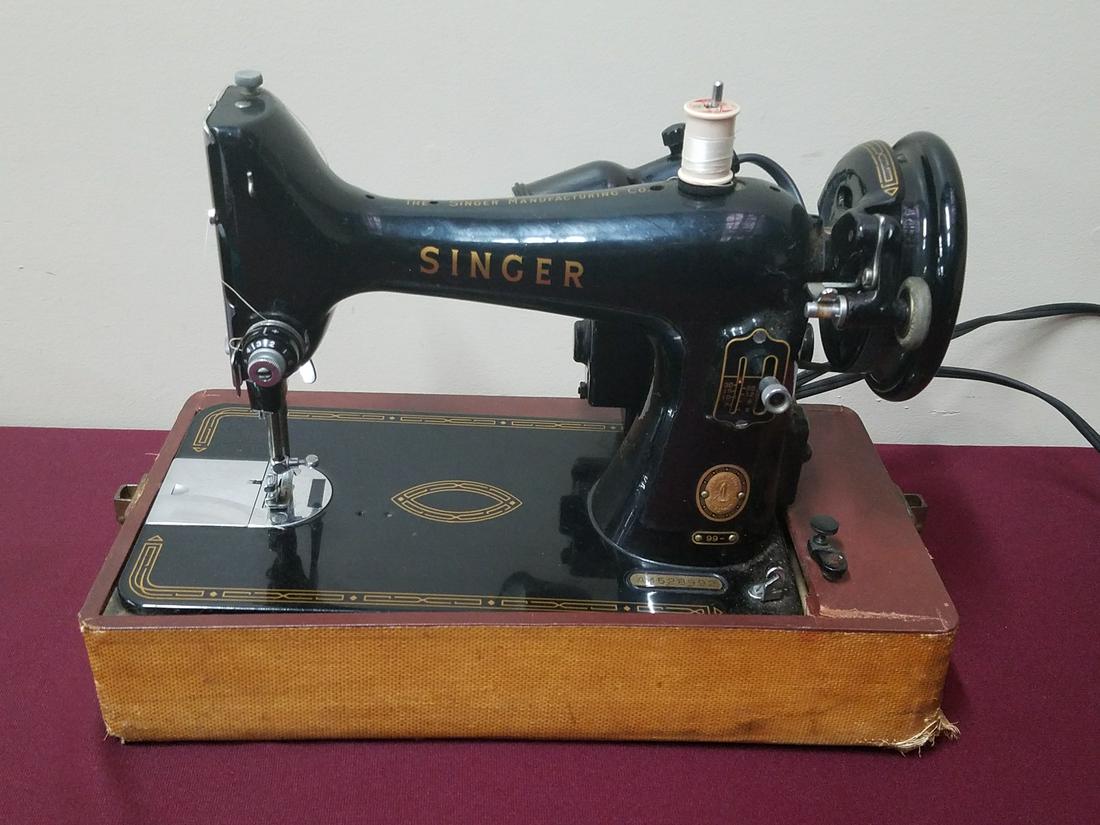 Singer Sewing Machine: Number AM528992. Motor runs intermittently.