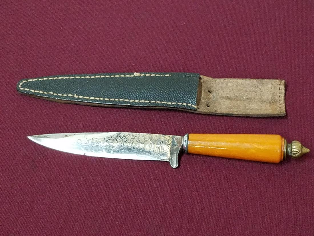 Dagger with Etched Blade and Bakelite Handle: 9" long. Blade etched "Anton G. Winger Jr. Solingen".