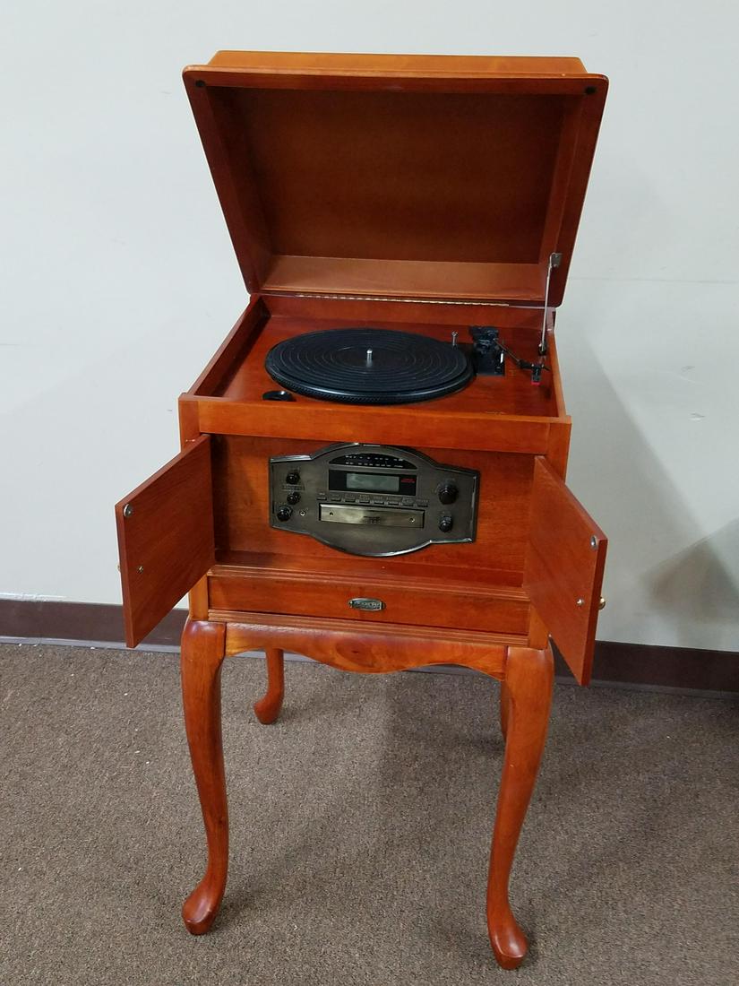 Crosley 4 in 1 Music Player: 19" wide x 19" deep x 35-1/4" high. In working order.