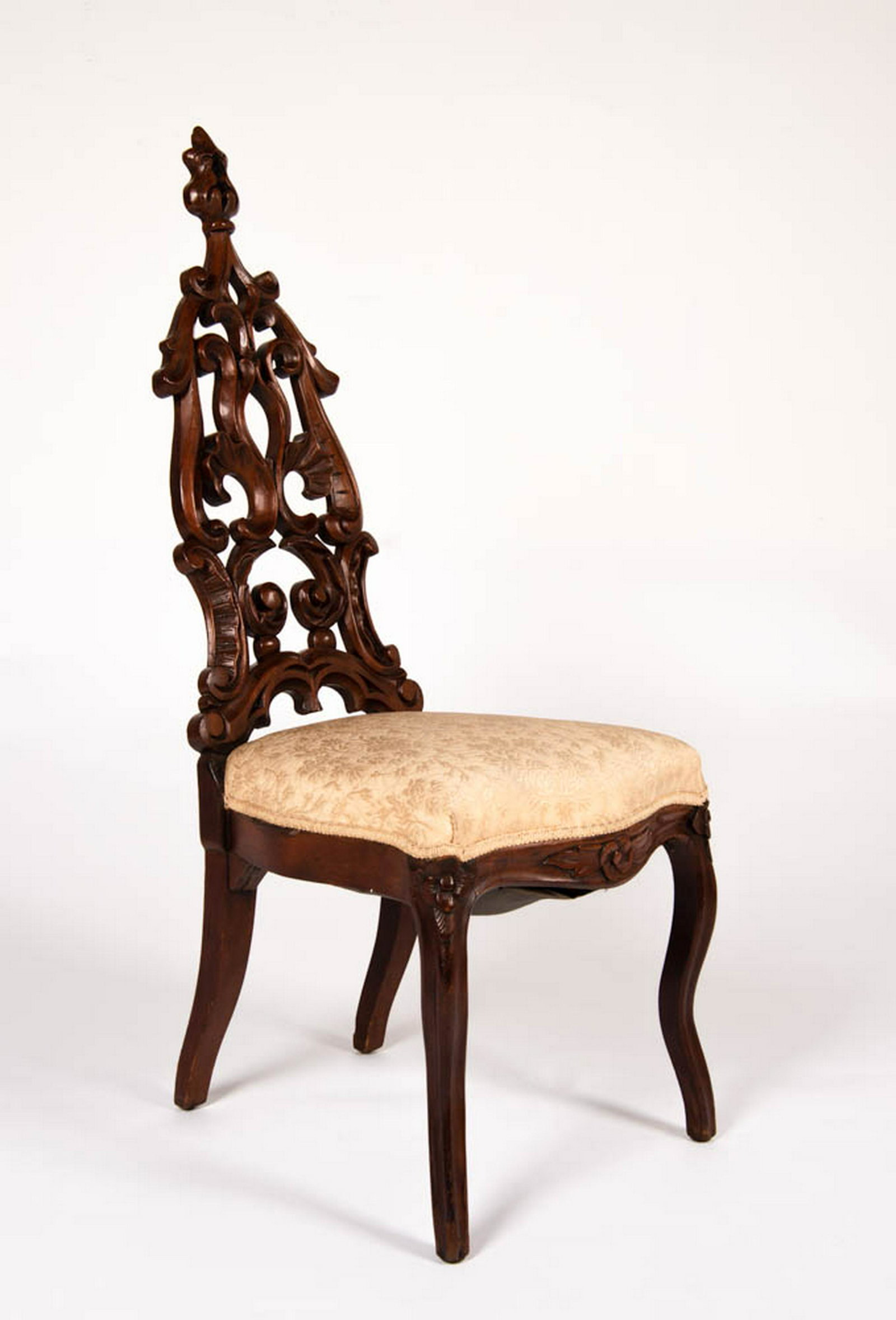 Gothic to Rococo Revival Victorian Hall Chair: DESCRIPTION: [Peter] This is a very unusual Victorian hall chair that ostensibly appears to be in typical Gothic Revival taste of the 1850s. However this example has cabriole legs and a more fluid roc