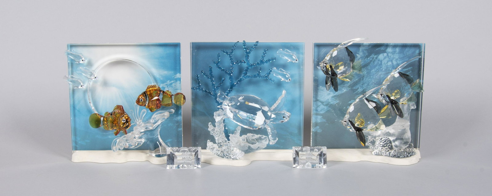 Swarovski Wonders of the Sea Trilogy: DESCRIPTION: Swarovski Crystal Society Wonders of the Sea trilogy with two plaques. Includes 2005 Harmony, 2006 Eternity, and 2007 Community. With original boxes for Eternity and Harmony. MEASUREMENTS