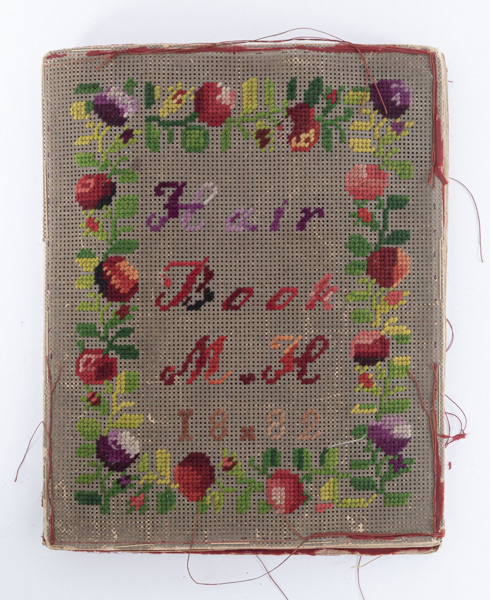 Victorian Friendship Hair Book: DESCRIPTION: Victorian friendship hair book with thirteen pages of hair samples stitched onto paper. Each with full name identification. "Hair Book M.H. 1882" stitched to cover and "Hair Book made by