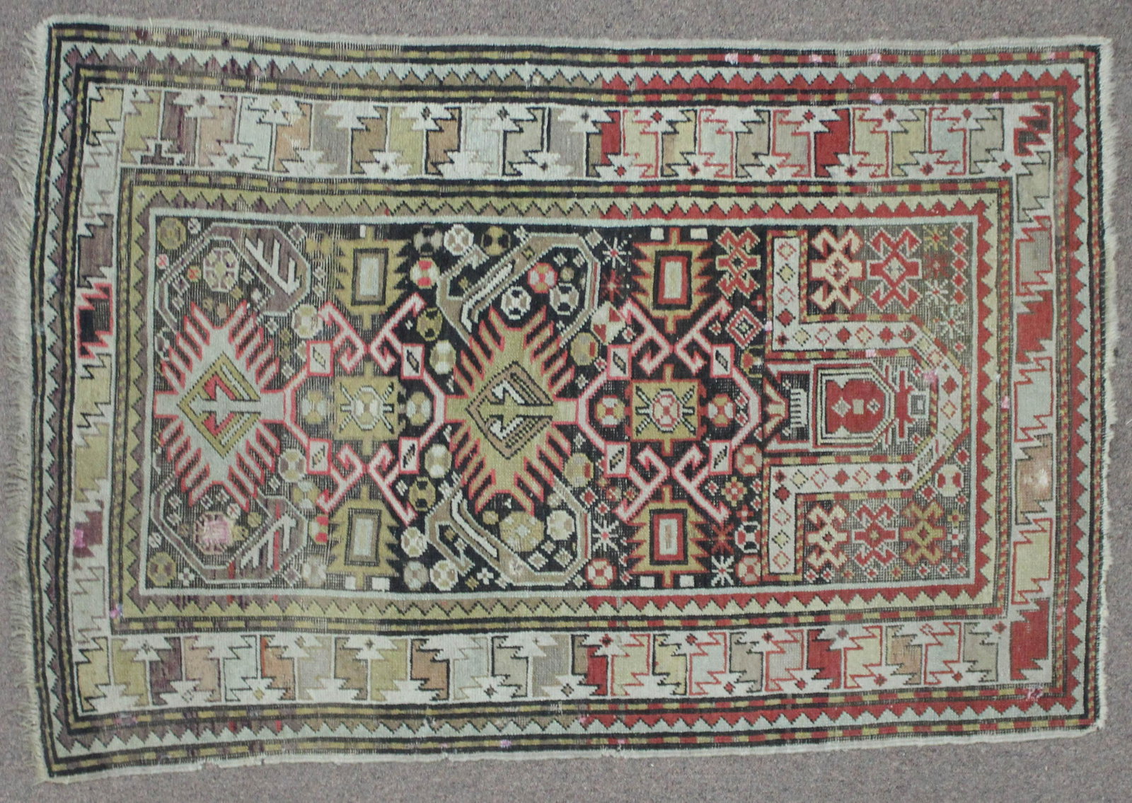 Caucasian Shirvan Prayer Rug: DESCRIPTION: Causacian shirvan prayer rug. 1900-1910. MEASUREMENTS: 4' 9" x 3' 2". CONDITION: Nine repairs (five with patches) to back.