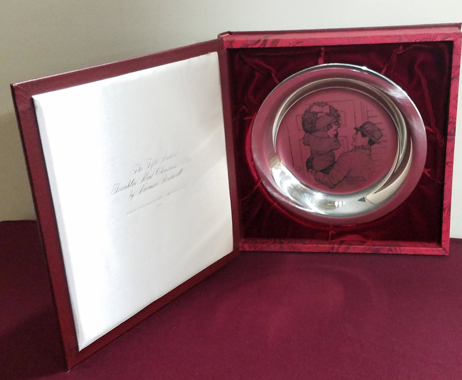 1974 "Hanging the Wreath" Sterling Plate: Done by Norman Rockwell. Certificate of authenticity included. 5.7 ozt.