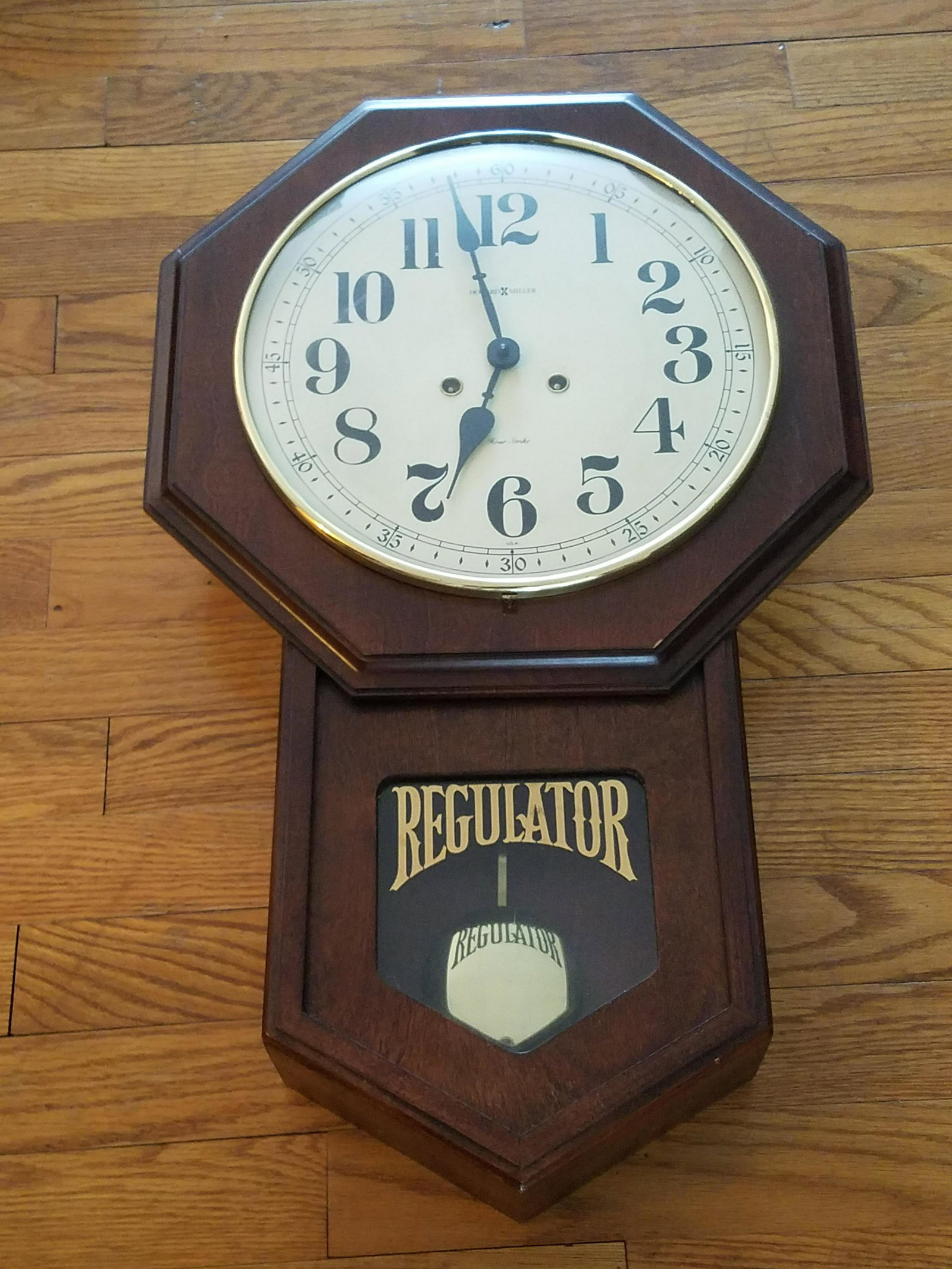 Regulator Wall Clock: 15" wide X 24 1/2" high.