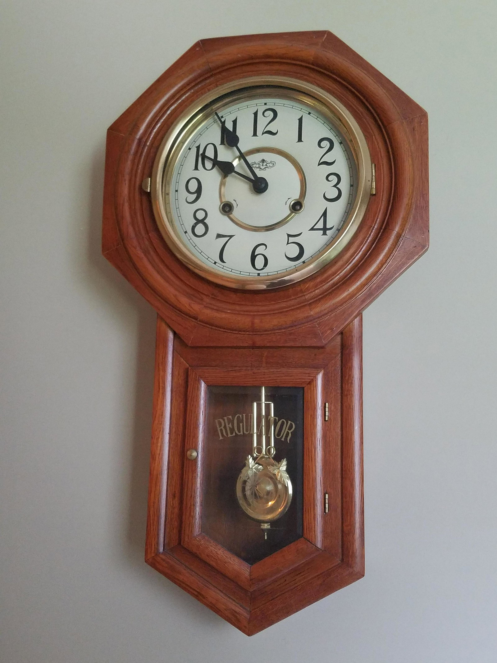 Regulator Wall Clock: 22-3/4" high x 11-3/4" wide. In working order.