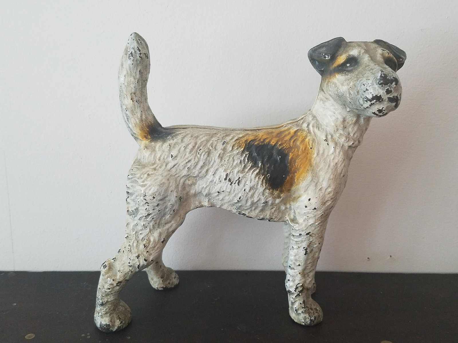 Cast Iron Dog Door Stop: 8-1/2" long x 8-1/4" high. Some paint losses.