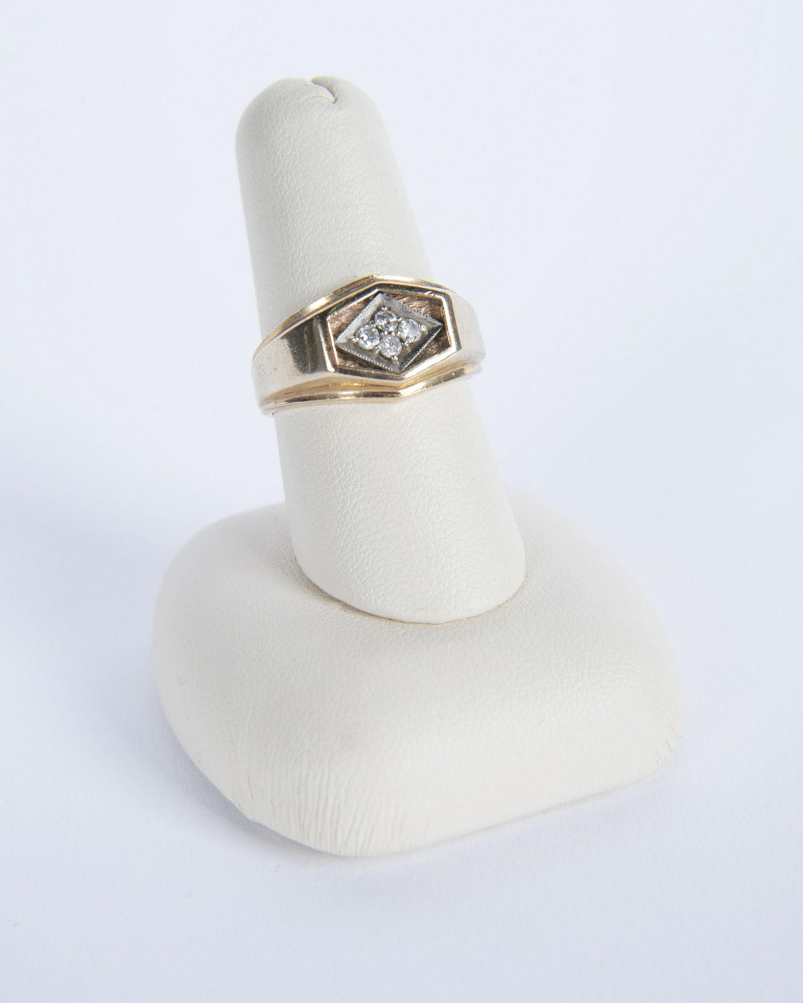 10k Gold and Diamond Ring: DESCRIPTION: 10k ring with four four-point diamonds. Marked 10k. MEASUREMENTS: 2.5 dwt (4.1 gr). Size 7.25. CONDITION: Light wear including minor surface marks.