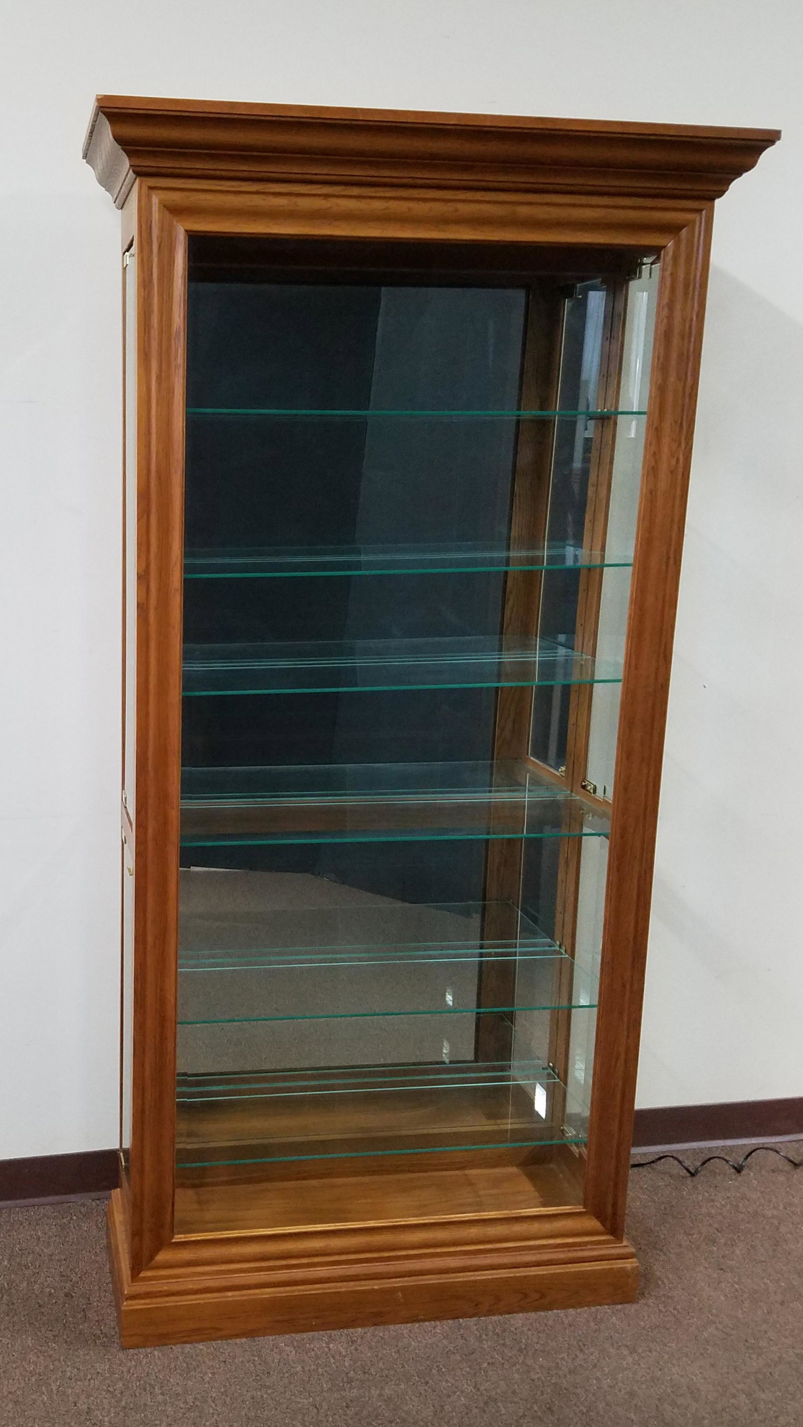 Lighted Side Door Curio Cabinet: 40" wide X 13 3/4" deep X 78" high. In working order.