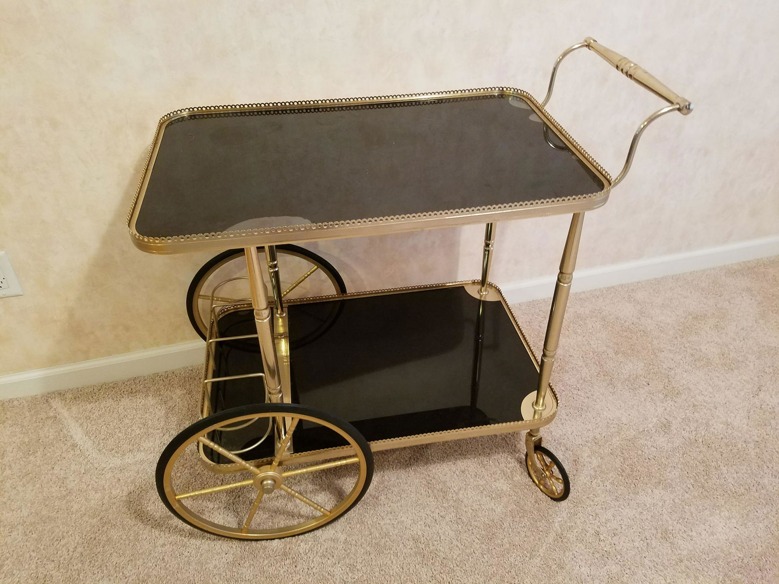 Black and Gold Tea Cart: 22 1/2" wide X 34 " deep X 32 1/2" high. Some discoloration to top.