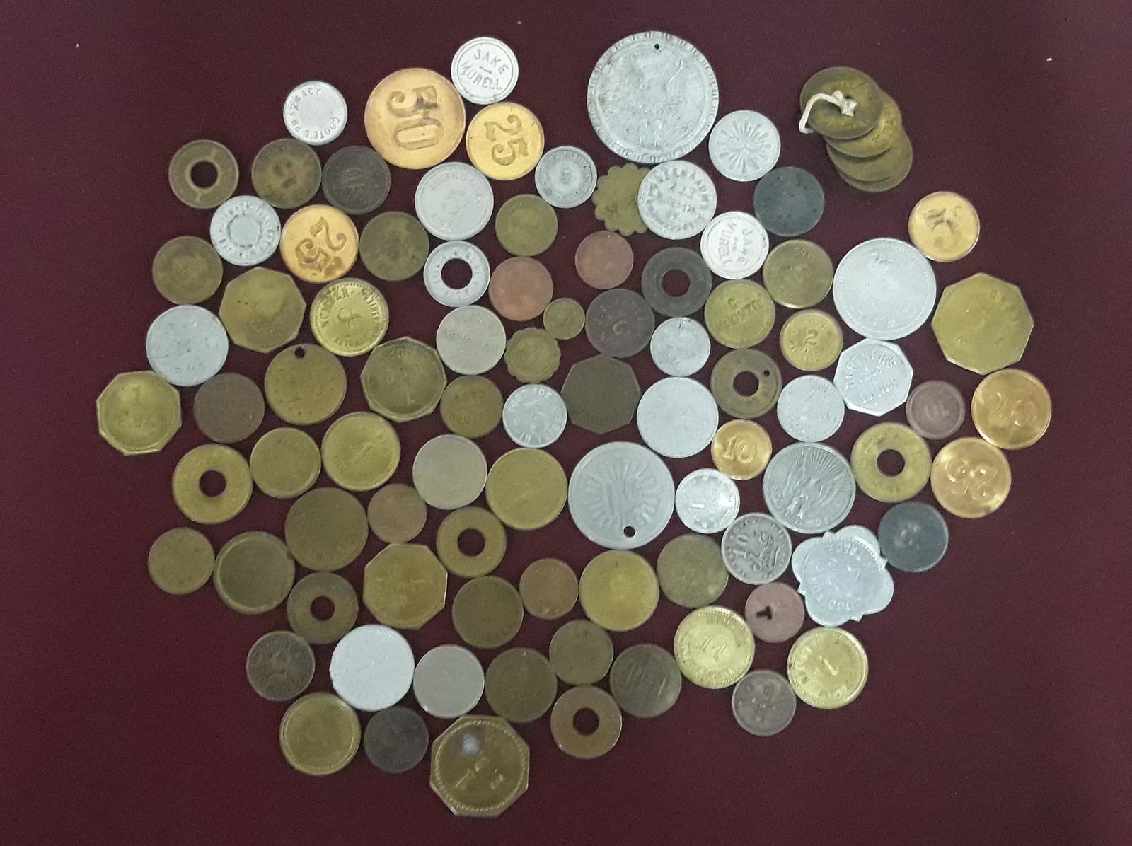 90 Trade Tokens: Includes 1. Benjamin's Pool Hall 418 Sixth Avenue/ Good for 5 cents in trade – Qty:42. Good for 50 cents in merchandise/ W. A. Horn Somersworth Bottler3. G.W. Holmes 10/ In trade 10 pat Jun. 1909 In