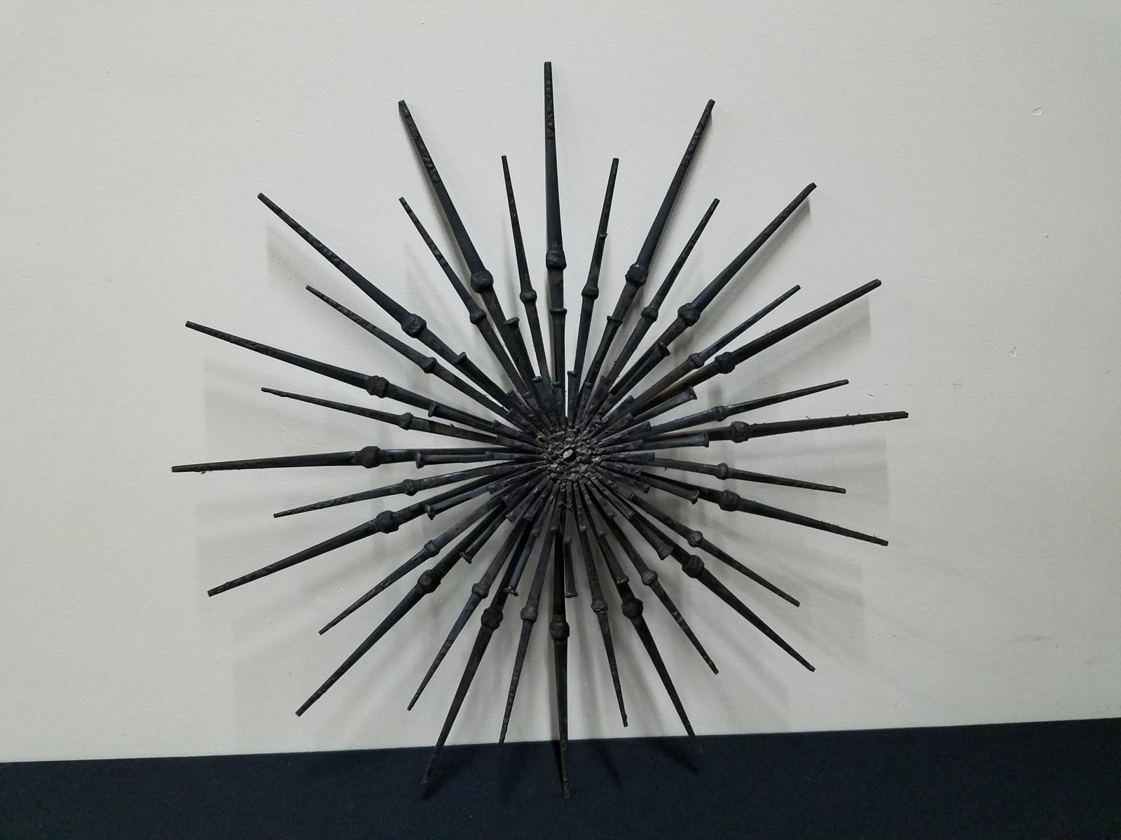 Modern Iron Sunburst Wall Sculpture: 25" diameter. 1 Piece detached.