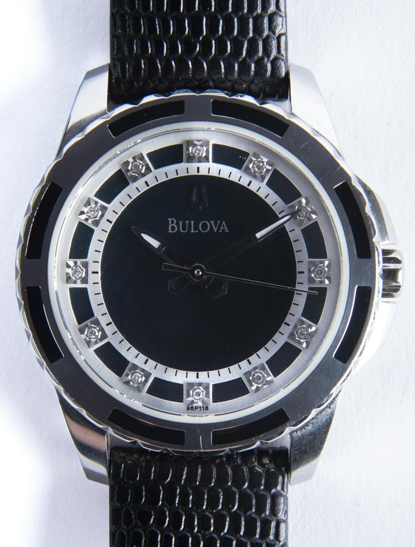 Bulova Diamond Wristwatch: DESCRIPTION: Bulova diamond wristwatch with original leather band. MEASUREMENTS: 1-1/2" lug to lug. CONDITION: Running. Very light wear.