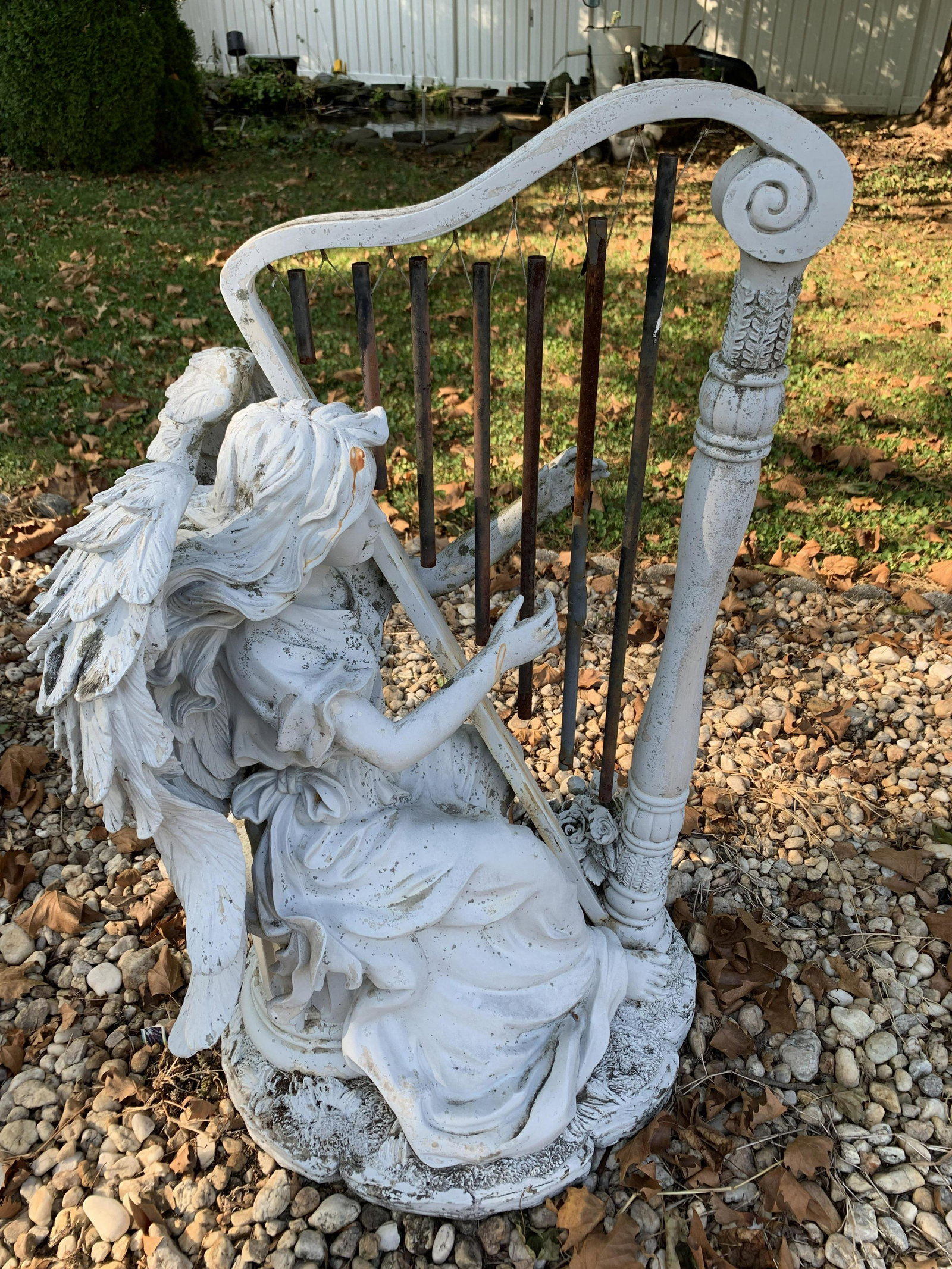 Harp Player Sculpture: 21 wide x 33 high. Made of resin material. Discoloration. Paint losses.