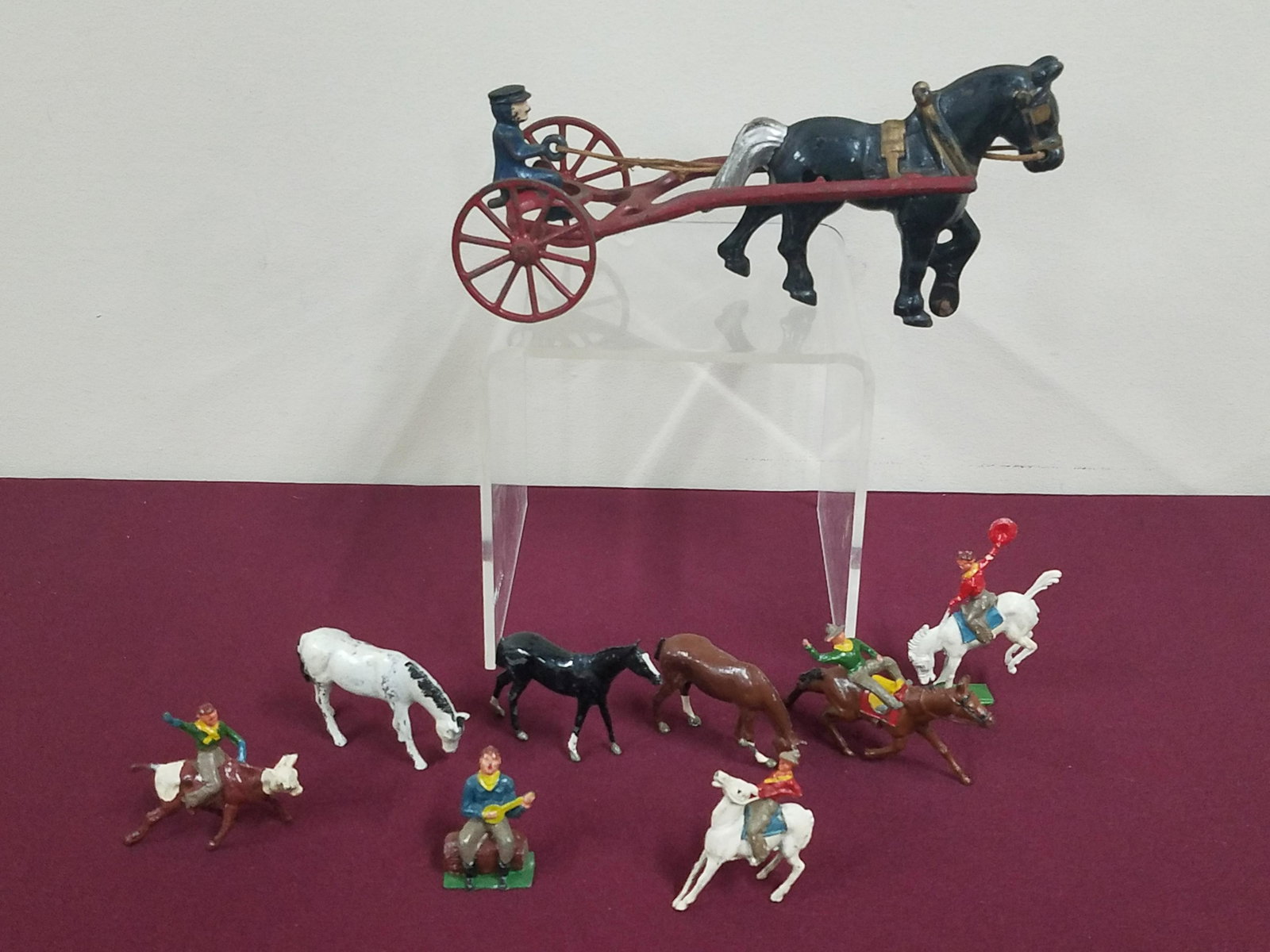 9 Pcs Metal Horses, Cowboys and Carriage: 1-3/4" to 4-1/2" high. Some paint losses.